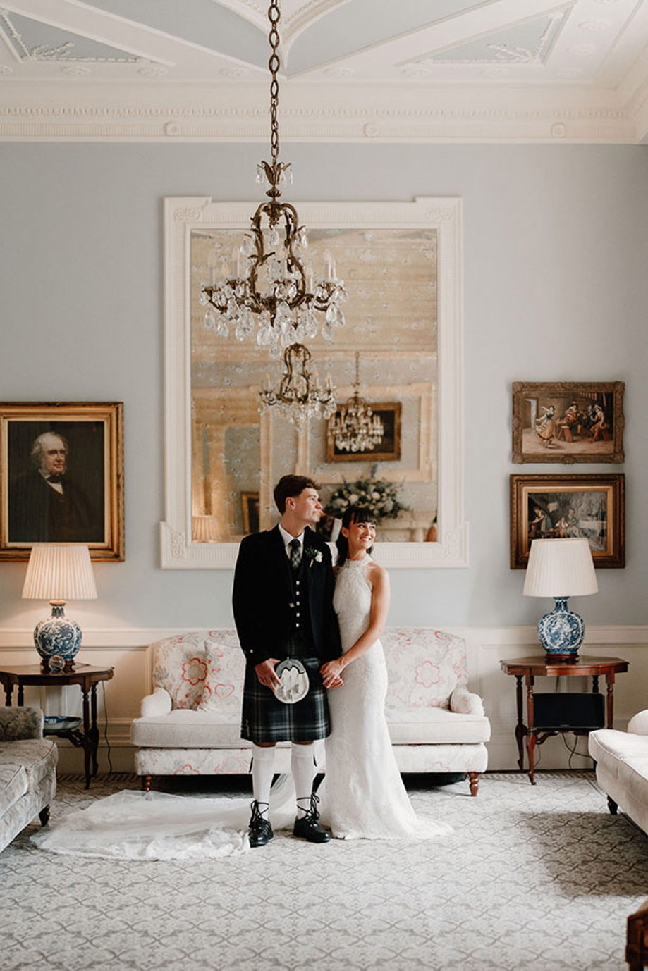 Bride and groom in blue drawing room at Crossbasket Castle